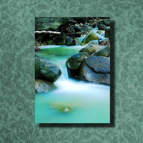 A stunning photo museum quality canvas gallery wrap of a teal green creek.