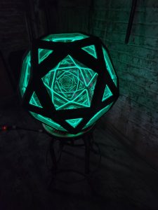 Illuminated geometric LED art sculpture by Chris Knight Creations, innovative custom lighting design.