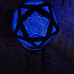 Illuminated geometric LED art piece with blue glow, handcrafted by Chris Knight Creations.