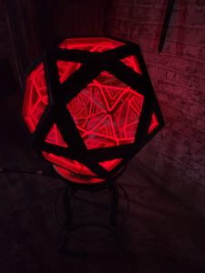 Illuminated geometric LED art sculpture by Chris Knight Creations, modern custom lighting design.
