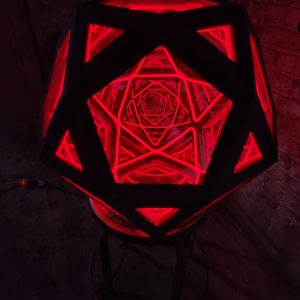 Illuminated geometric LED lamp with intricate red patterns, stylish home decor by Chris Knight Creations.