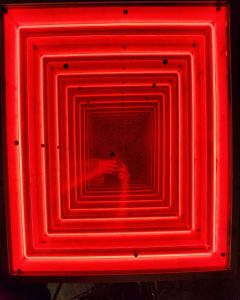 Vivid red neon square light art, modern illuminated wall decor for stylish interior spaces.