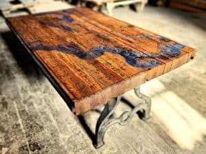 Vintage reclaimed wood coffee table with metal legs, handcrafted by Chris Knight Creations.